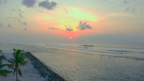 Slow flight back to the island Flight over Palm Island White sand Evening on Stock Footage 220626064