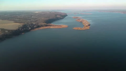 Slow flight of a drone over the autumn forest and attractive river. Bird's eye Stock Footage 165453129