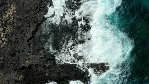 Slow flight over black rocks Stock Footage 104424217
