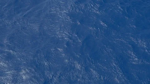 Slow flight over a calm surface of the blue rippled sea Stock Footage 116667053