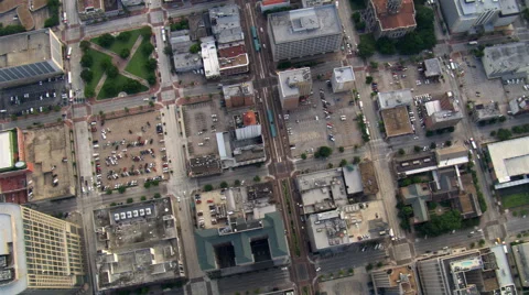 Slow flight over Houston's low-rise buildings, muddy Buffalo Bayou, and  massed Stock Footage 59510451