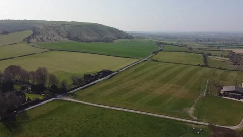 A slow flight over the patchwork of fields in Wiltshire UK Stock Footage 172488117