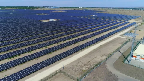 Slow flight over rows of solar panels in summer Video stock 153358135