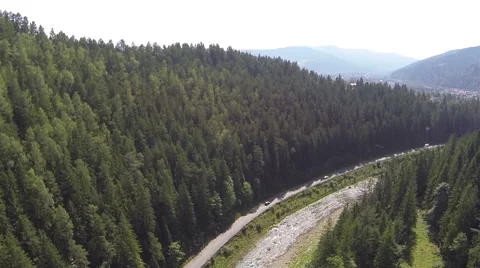 Slow flight over  valley of river with road  and mountains. Aerial  Stock Footage 43106370