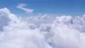 Slow flight through cumulus clouds in blue sky, blessing magic, religion, heaven HD Footage