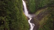 Slow Floating Nature Aerial At Big Misty Waterfall In Bright Green Forest Stock Footage
