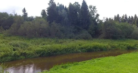 Slow flow of the river among the summer meadows. Aerial view. Stock Footage 96144216