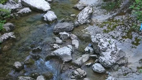 The slow flow of the river between the rocks. Stock Footage 86433220
