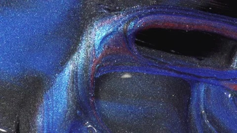 Slow flowing liquid colored pearlescent paint close up Stock-Footage 130567241