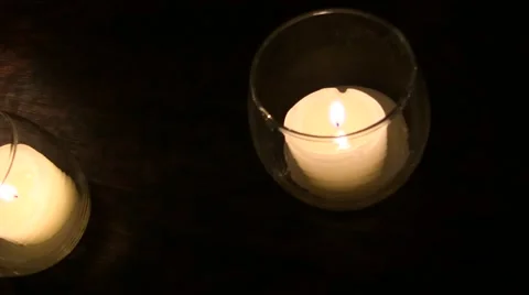 Slow flying pan over some candles at a wedding reception Stock Footage 62392225