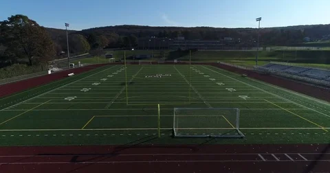 Slow flying through goalpost to the other post towards Bristol CT Central High Stock Footage 82327088