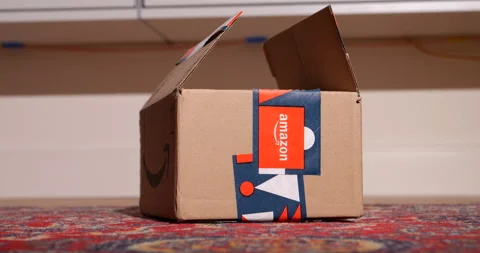 Slow focus to Amazon winter holidays gift package parcel cardboard with Stock Footage 233354704