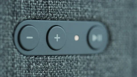Slow focus pulling on smart speaker controls 4K video Stock Footage 172110965