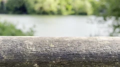 Slow focus shift past old wooden handrail 库存影片 334760155