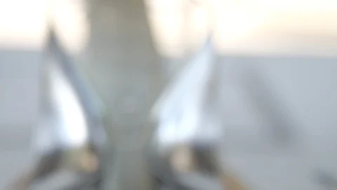 Slow focus towards engagement ring in between silver high heels Stock Footage 112140635