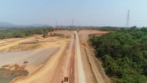 Slow forward drone shot of construction site with excavator and truck Stock Footage 346160377