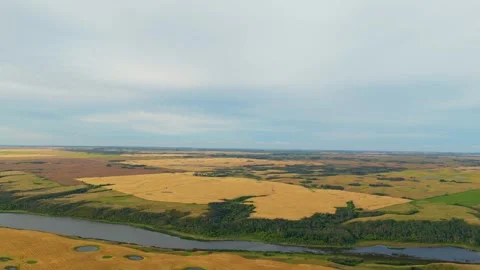 Slow Forward Drone Shot Over Southern Manitoba Farmland and River Stock Footage 347925556