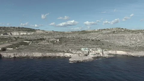 Slow forward-facing aerial over the Mediterranean with a downwards panning 動画素材 112391803