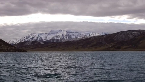 Slow Forward Flight over Choppy Lake with Storm Clouds Vídeos de archivo 87673414