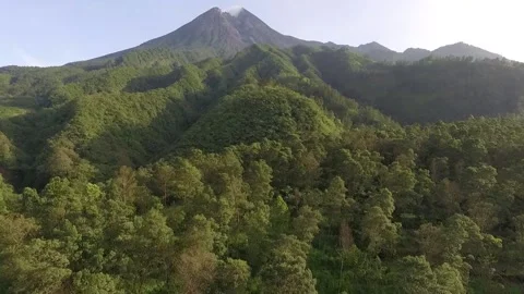 Slow forward movement using drone for video of Mount Merapi and valley fores Stock Footage 158110851