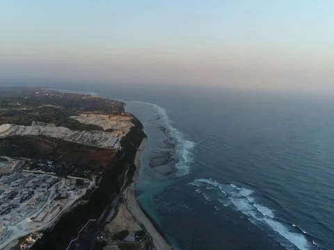 Slow forward over beach, cliffs, and ocean in Bali, Indonesia. Stock Footage 80178305