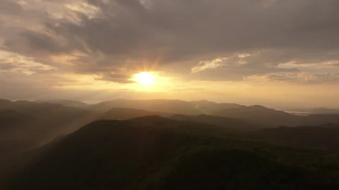 Slow forward track of sun and mountains early morning Video stock 246646268