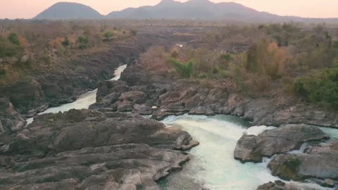Slow forward travelling of Li Phi Somphamit Waterfalls at sunset. Don Det, Laos. Video stock 246940577