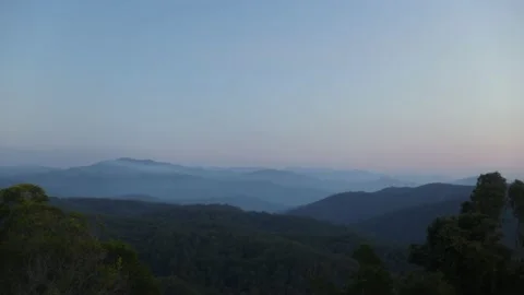 Slow Gentle Sunset Over Rolling Mountains Stock Footage