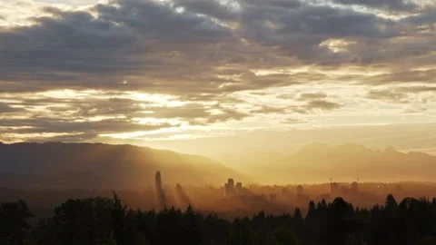 Slow Golden Sunrise Timelapse with Mountains and Streams of light with backdrop Stock Footage