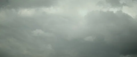 Slow grey puffy clouds anamorphic Stock Footage 242792777