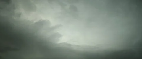 Slow grey puffy clouds anamorphic Stock Footage 242799987