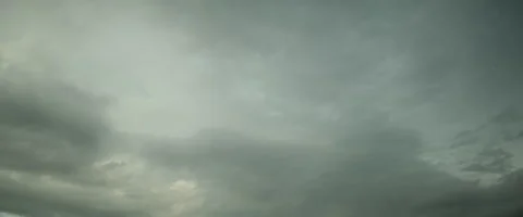 Slow grey puffy clouds anamorphic Stock Footage 242799992