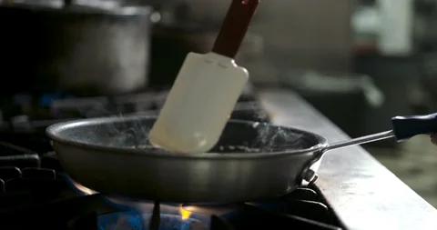 Slow hand held shot while making a made to order cream sauce Stock Footage 105376967