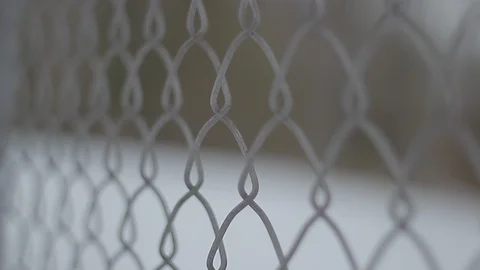 Slow Handheld Push Past Chain Link Fence Stock Footage 106681632