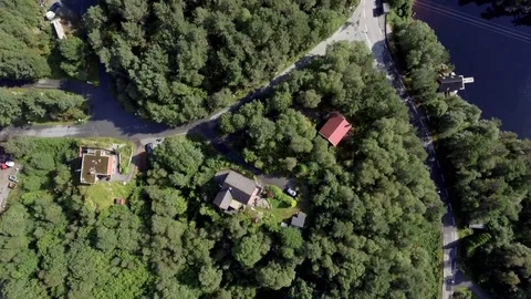 Slow helicopter flight over typical Norwegian city by sea in good sunny weather Stock Footage 83736272