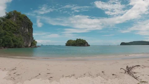 Slow hitting the camera with views of the Islands and rocks on a sandy beach Stock Footage 135124359