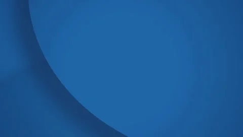 A slow horizontal pan across deep blue curved layers in a seamless loop 库存影片 341274664