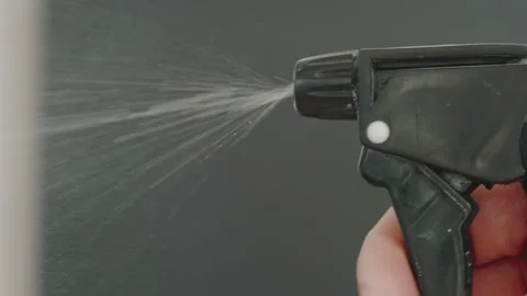 SLOW: Human hand presses the sprayer - Close Up 動画素材 137769329