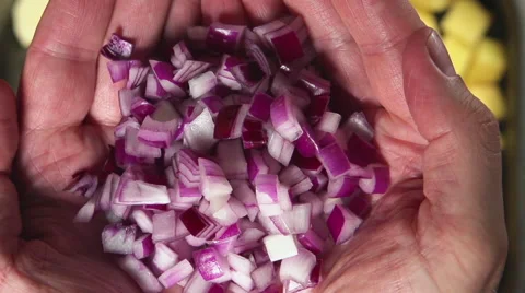 SLOW: Human hands hold a cut red onion and throw it Stock Footage 63896917