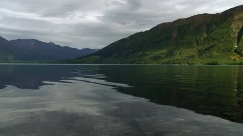 Slow Jib Pan Left over Alaska's Kenai Lake Stock Footage 12234386