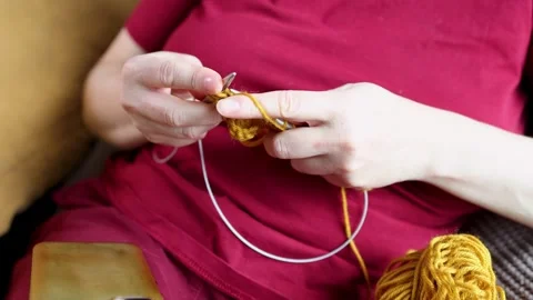 Slow knitting moment: mindful handwork with yellow yarn at home for digital Vídeos de archivo 346146968