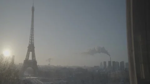 Slow lateral pan across the Paris skyline with the Eiffel Tower in clear view Stock Footage 333675977