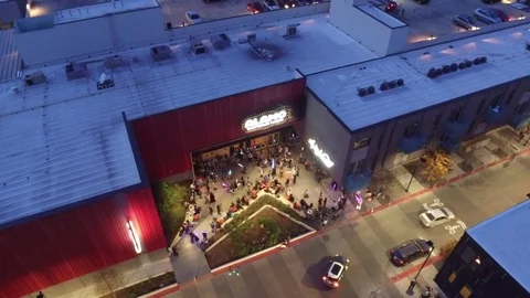 Slow Left Pan Aerial Drone Establishing Shot of Contemporary Movie Theater Video stock 71104843