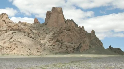 Slow, left pan during a time-lapse shot of New Mexico's Shiprock. Stock Footage