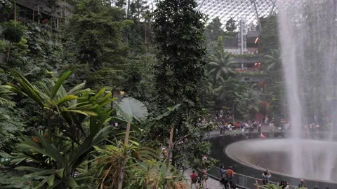 Slow left to right around at Changi Jewel Waterfall vortex Video stock 294686037