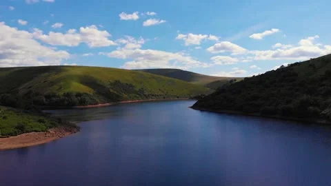 Slow lift over cloud reflections on Meldon resevoir, Devon, UK 動画素材 135519735