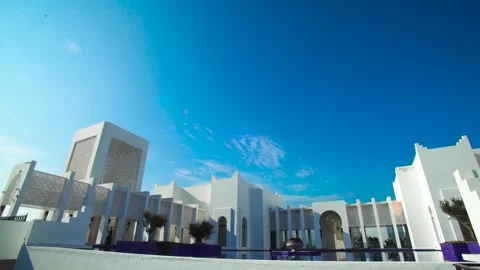 Slow low angle shot of famous luxury Banyan Tree Hotel Building against Stock Footage 147743075