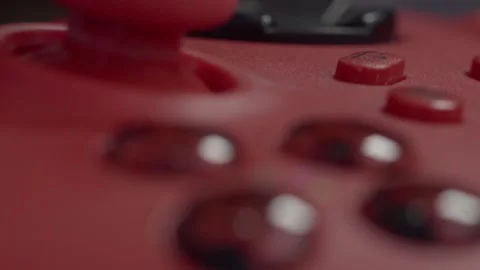 Slow Macro and closeup on red game console controller with joystick and slowly Stock Footage 321198572