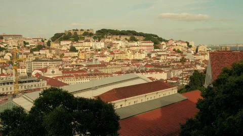 Slow medium pan clip across the rooftops of central Lisbon Stock Footage 118372224