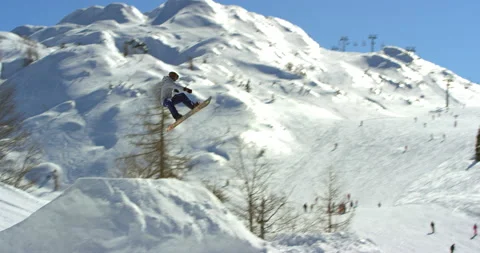 Slow Mo Of Active Man Doing Tricks With Snowboard Stock Footage 139395458